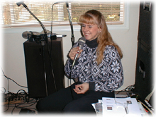 Tonya with microphone in hand